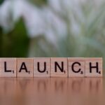 Scrabble tiles spelling 'launch' reflecting entrepreneurship and innovation.